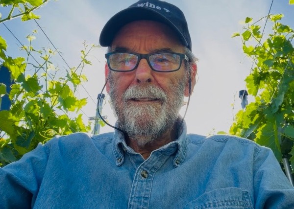 Jeff Kuns, winemaker at Quail Rock Vineyard, among the vines in Valle Vista, Arizona