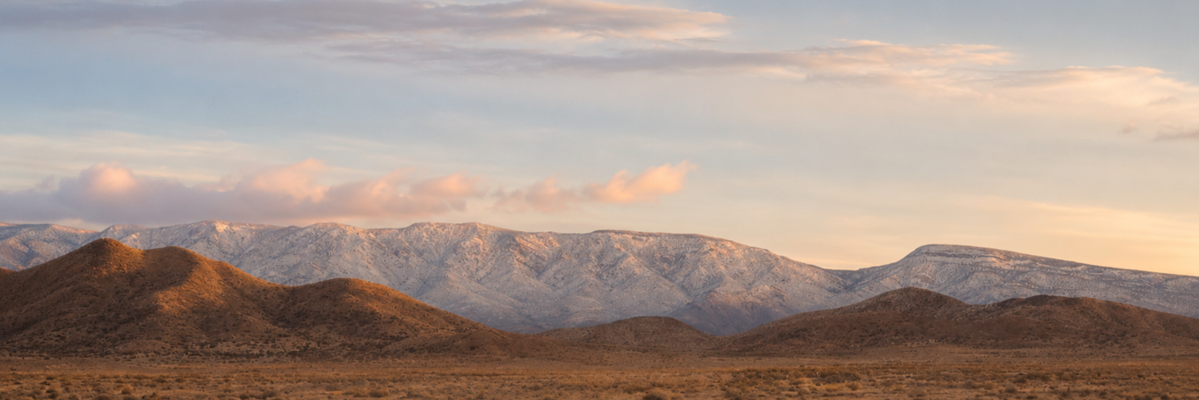 Sunset light on the Hualapai mountain range above the high desert near Valle Vista, Arizona